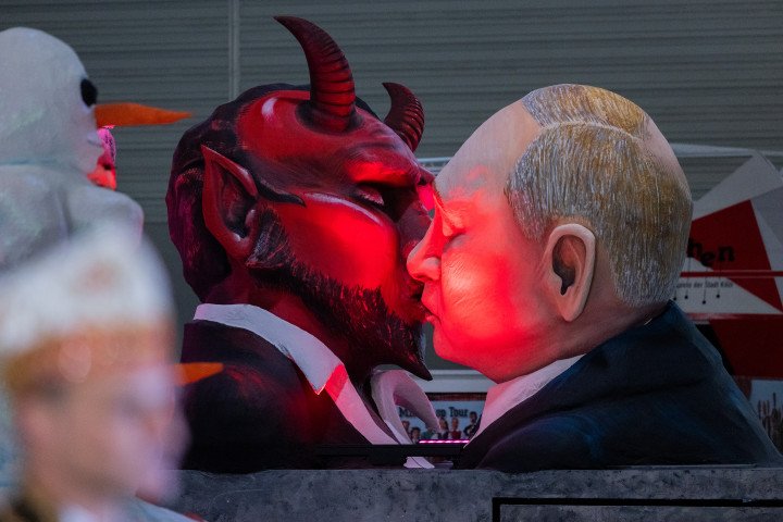 A theme float of Russia's Leader Vladimir Putin kissing the devil at a parade in Germany (Source: Rolf Vennenbernd via Getty Images) A theme float of Russia's Leader Vladimir Putin kissing the devil at a parade in Germany (Source: Rolf Vennenbernd via Getty Images)